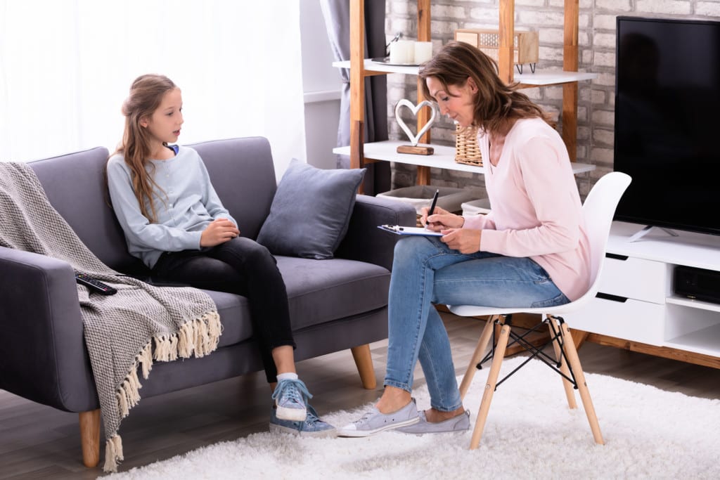 Young girl seeing an accelerated resolution therapist to treat reactive attachment disorder